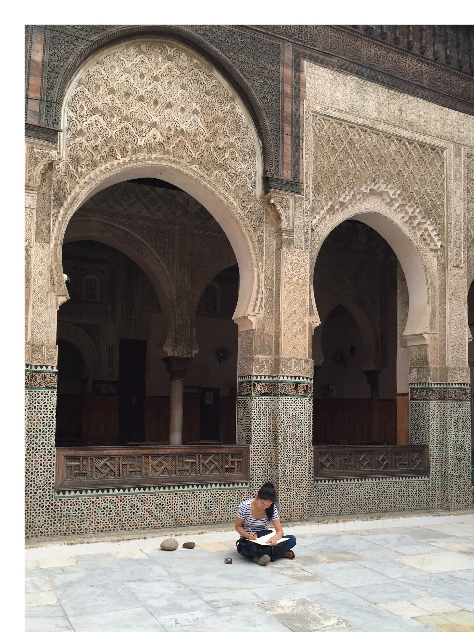 Sandra Nam Cioffi sketching in a Moroccan courtyard during research for the Aga Khan Garden, Fez
